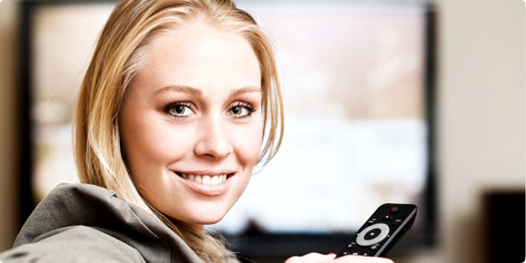 woman watching DIRECTV